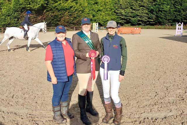 Ard Lú Riding Club Chairperson Linda Nulty congratulating members, Emma Bell and Marta Esquíroz McCloskey who placed 1st and 6th in their classes at the Grassroots Jump Training Series Final. (Pic: Ard Lú Riding Club)