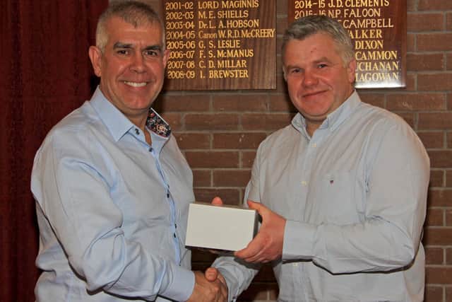 Outgoing Holstein NI chairman Alex Walker, right, presents a token of appreciation to AGM guest speaker Mark Nutsford. Picture: Julie Hazelton