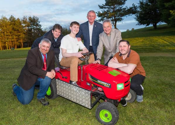 Members of Saintfield Show Committee with Father and Son team Ethan and Barry McGreevy (Members of NI Lawnmower Racing Association)