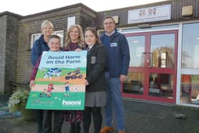 Pictured at the launch of the ‘Avoid Harm on the Farm’ 2024 child safety calendar, from left, Deirdre Goan, HSENI, Taylor Kelly, Janet Burke, (Principal), Hollie Gibson, (all Denamona PS), and Robert Kidd, HSENI CEO. (Pic: HSENI)
