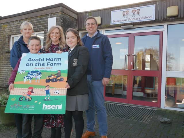 Pictured at the launch of the ‘Avoid Harm on the Farm’ 2024 child safety calendar, from left, Deirdre Goan, HSENI, Taylor Kelly, Janet Burke, (Principal), Hollie Gibson, (all Denamona PS), and Robert Kidd, HSENI CEO. (Pic: HSENI)
