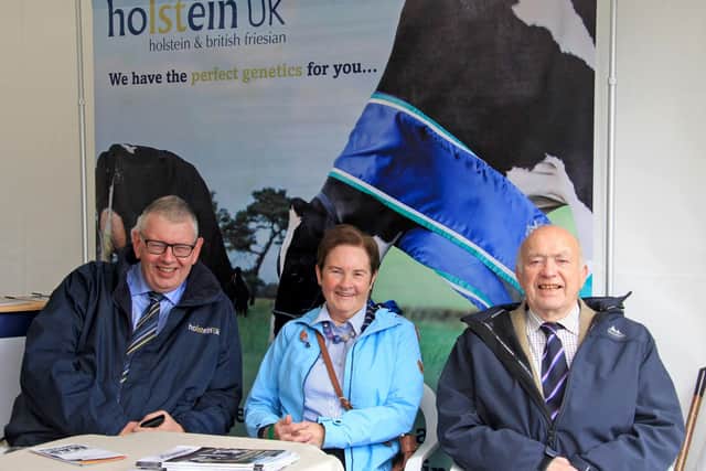 Enjoying Balmoral Show are John Martin, secretary, Holstein NI, with former assistant club  secretary Elaine Power; and Wilbert Rankin who has been attending Balmoral Show for 75 years. Picture: Julie Hazelton