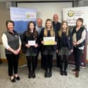 Second place was awarded to Aughnacloy College. Pictured alongside Kyla, Catherine and Sarah include judges Roberta Simmons, Steven Millar, John McLenaghan and Julie-Ann Lyle.