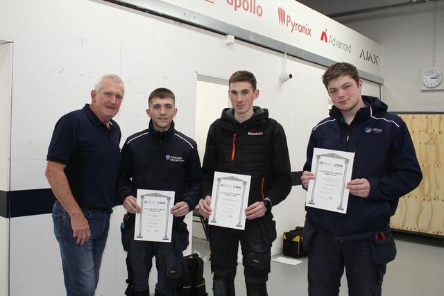 Skillbuild Fire & Security Competition SERC: (l-r) Robin Hamill, Deputy Head of School Construction with Level 3 Fire & Security Systems Apprentices T, all based at Lisburn Campus, Taylor Rollo from Newtownards (1 st place) employed by SR Fire & Security; James Curry from Banbridge (2 nd place) employed by Beacon; and Luke Wilson from Newtownabbey (3 rd place) employed by Atlas World. Pic: SERC