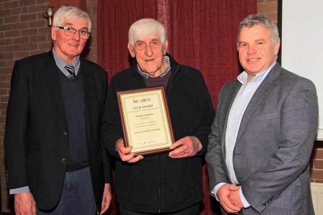 George Smyton, Fivemiletown, received the Club Award at Holstein NI’s AGM, from  David Perry, president; and outoing chairman Alex Walker. Picture: Julie Hazelton