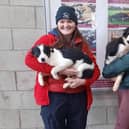 Cuddling the pups in the are, left, Andrea McKee from Crossgar, one of the new owners. To the right is Lean Rodgers from Dromara, representing the vendor Simon Gibson from Ballgowan. Picture: Downpatrick Mart