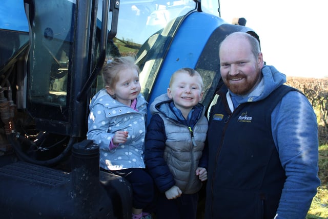 Alan McKinstry with his children Evie and Alfie at the tractor run on Monday.