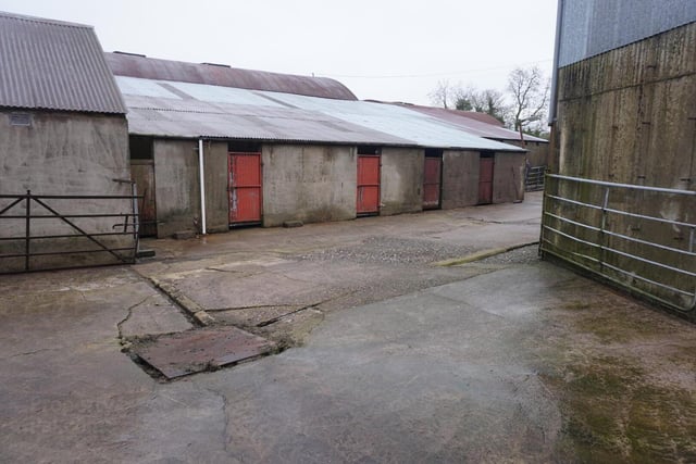 It includes a four bedroom farmhouse and an extensive former dairy farmyard with approximately 107 matted cubicles.