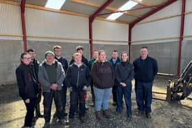 Standing in the new machinery shed that will deliver enhanced agri-educational opportunities for students attending Castle Tower School in Ballymena. Featured are the 2026 cohort of Castle Tower students who had an input into the development of the shed with their teacher Ciaran McCaughan (right) who was joined by teaching teaching assistants Shireen Davidson (second right) and Norman Manson (second left). Also featured is Moore Concrete's Maeve Birt (left). The new building predominantly features Moore Concrete wall panels.