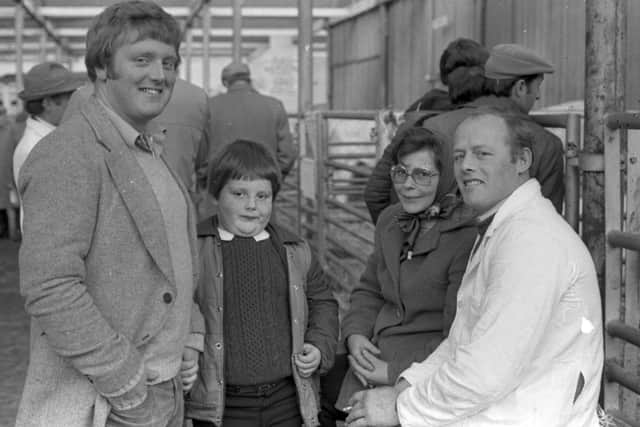 Pictured in November 1982 is Brian McAllister with his son from Kells, with Mr and Mrs James Simpson from Templepatrick at a Charolais breed show and sale which was held at Portadown. Picture: Farming Life/News Letter archives