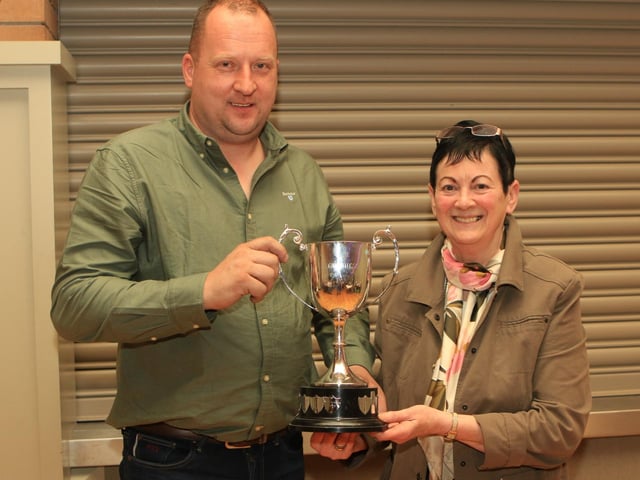 Jonny Hazelton receiving the Guinness Cup for the overall Champion with RANFURLY LADY DIANA 41st from Ruth Montgomery, Clogher show secretary