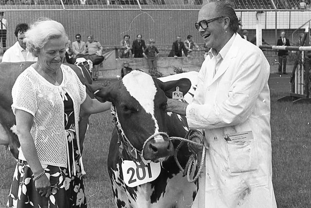 Mr Charles Suffern of Crumlin pictured at the Ballymena Show in June 1982 with the supreme champion Ayrshire cow, which headed all the dairy breeds at the show. Mrs Orr presented the Ballymena Livestock Mart sash to Mr Suffern. Picture: Farming Life/News Letter archives