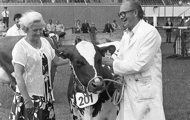 Mr Charles Suffern of Crumlin pictured at the Ballymena Show in June 1982 with the supreme champion Ayrshire cow, which headed all the dairy breeds at the show. Mrs Orr presented the Ballymena Livestock Mart sash to Mr Suffern. Picture: Farming Life/News Letter archives