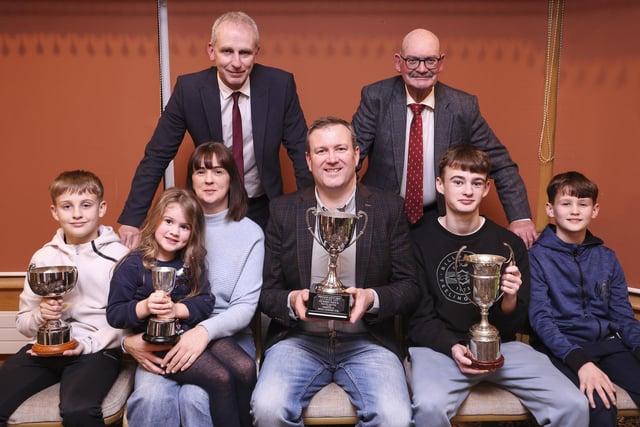 Andrew Kerr (front centre), and family winners of The poultry section at Fermanagh Show. Pictured are from left, Samuel, Isabella, Sandra, Matthew and Joshua. Back from left is Mark Wright, Guest Speaker and Eddie Rogers, Fermanagh Show.
