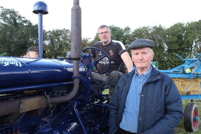 David Alexander and David McCune admiring the tractors.