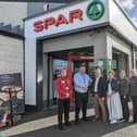 Kieran McGirr (left) assistant manager at SPAR Anderson Gardens, Jimmy and Una McGirr (centre) and Justine and Kelly McGirr (right), customer advisors at SPAR Anderson Gardens are pictured with Jeremy Mitten, Area Manager with Henderson Retail (second left). Pic: Aaron McCracken