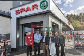Kieran McGirr (left) assistant manager at SPAR Anderson Gardens, Jimmy and Una McGirr (centre) and Justine and Kelly McGirr (right), customer advisors at SPAR Anderson Gardens are pictured with Jeremy Mitten, Area Manager with Henderson Retail (second left). Pic: Aaron McCracken