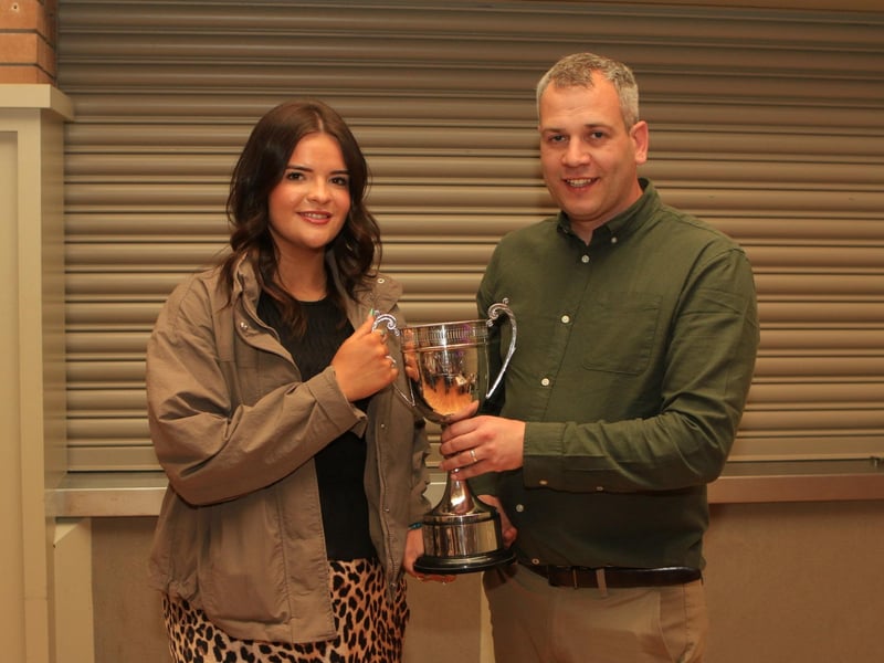 Lexi Heatrick along with chairman Shane McDonald, receiving the Betty Walker Memorial Perpetual Challenge Cup for Club Member of the Year.
