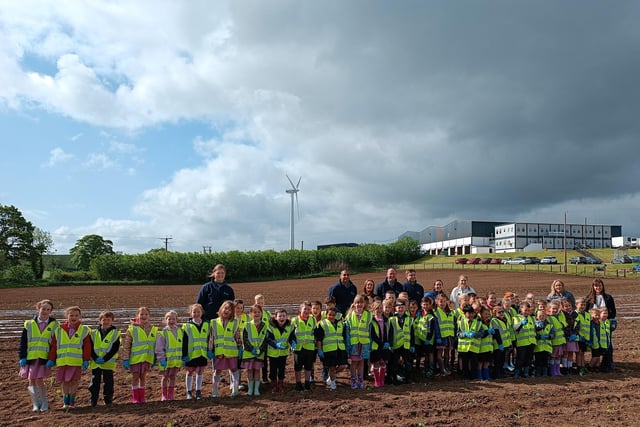 Primary 3 pupils and staff from Hardy Memorial Primary School pictured with Gilfresh Produce staff members during their recent visit to the company. The pupils planted some pumpkins and got a tour of the facilities at Gilfresh.