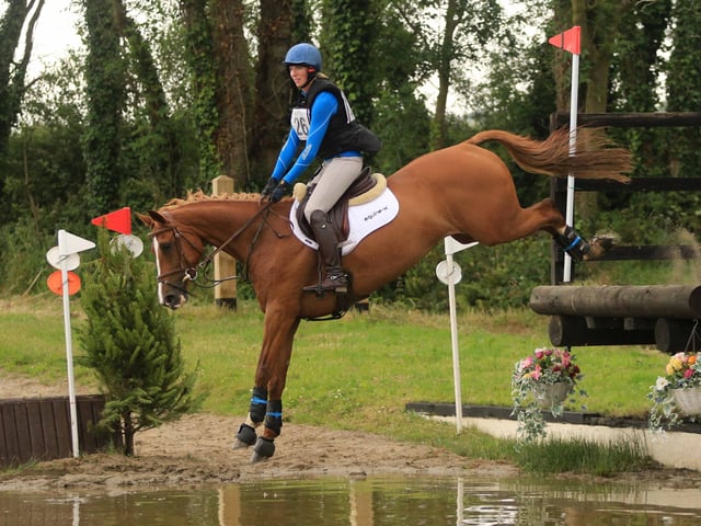 Suzanne Hagan and Karolita O jump into Tullymurry's water complex where they took 2nd in the EI110(Open) class. (Pic: Anne Hughes)