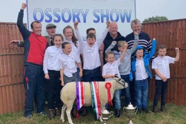 Beltex Premier Sale Judge John Maher is pictured with family, celebrating their Interbreed Champion win at Ossory Show with Ballinakill Everything.