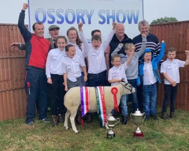 Beltex Premier Sale Judge John Maher is pictured with family, celebrating their Interbreed Champion win at Ossory Show with Ballinakill Everything.