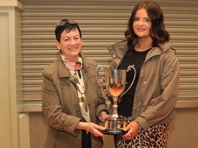 Ruth Montgomery, Clogher show secretary, pictured with Lexi Heatrick receiving the Valley Hotel Perpetual Cup for best heifer calf born in year of the show for BALLINALARE FARM TIKITA