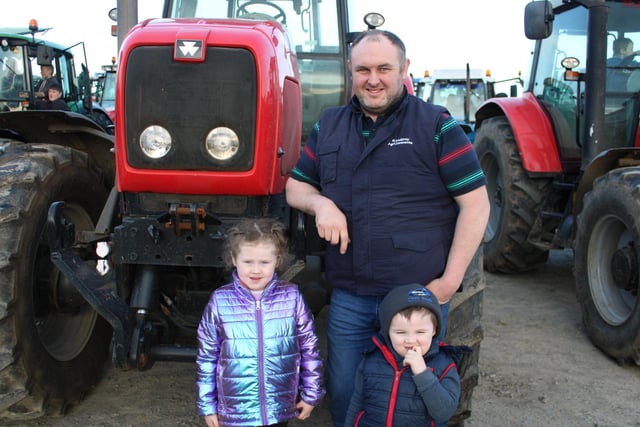 Richard McElroy and children Ivy and Knox at the tractor run.
