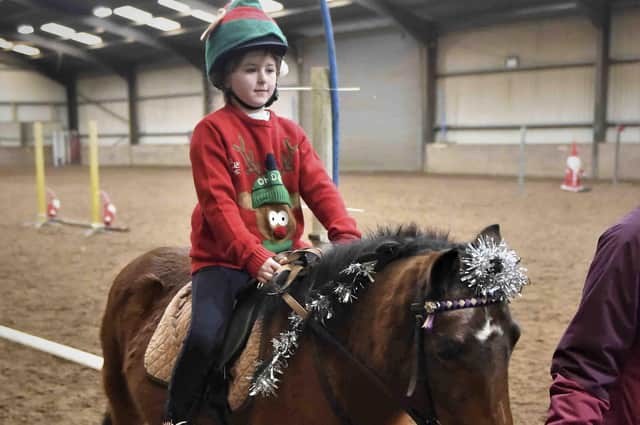 Mya McKay and Matilda make their way around the Tinsel Tangle Obstacle Course - Photo by Equi-Tog