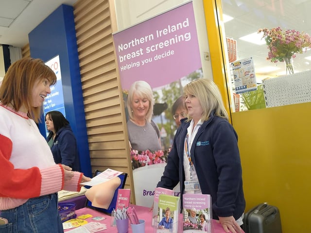Paula Kennedy (Breast Imaging BHSCT) talking to shoppers about breast cancer during the event.
