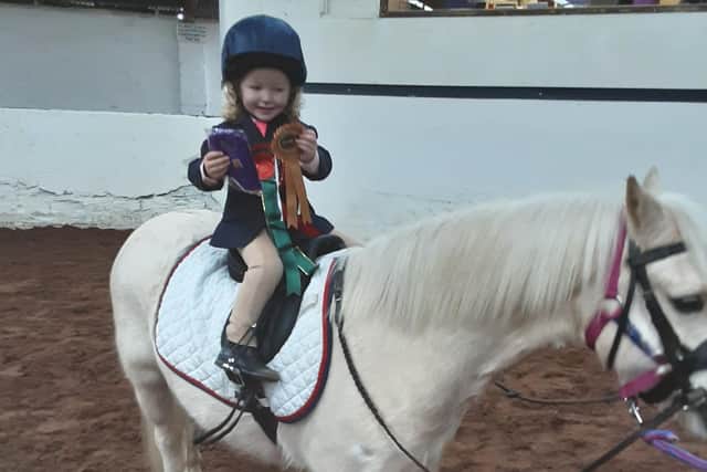 Little Olivia Ward received her rosette as an individual rider on Oscar. (Pic: Mossvale)