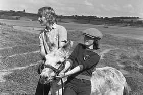 Fred the donkey made such an obstinate ass of himself in August 1980 that he had to be withdrawn from the Strangford Festival donkey derby. It took the combined strength of Ciara Sampson and Maura Savage to get him out of the way. Picture: News Letter archives/Darryl Armitage