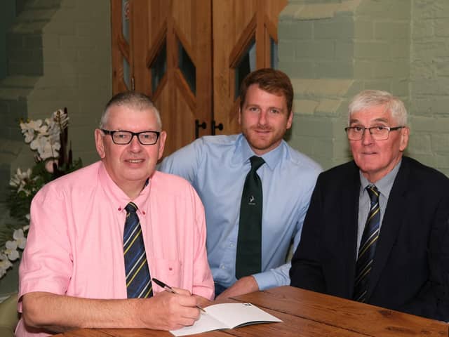 Discussing agenda for Holstein NI AGM are secretary John Martin; Jonny Lyons, chairman; and David Perry, president.  Photograph: Columba O'Hare/ Newry.ie