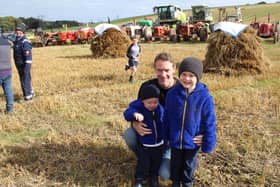 Steven Leckey with Leo and Odin watching the threshing Day. Picture: Billy Maxwell
