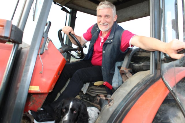David Megaw with his pet dog Sam  at the tractor run. Picture: Billy Maxwell
