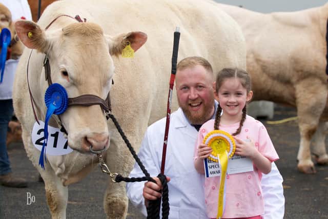 Eamon McGarry with niece Caiheigh along with his second placed senior cow, Budore Jessie.