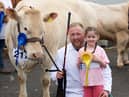 Eamon McGarry with niece Caiheigh along with his second placed senior cow, Budore Jessie.