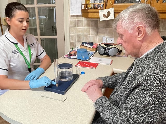Occupational Therapist, Niamh Shine with Hugh during an assessment
