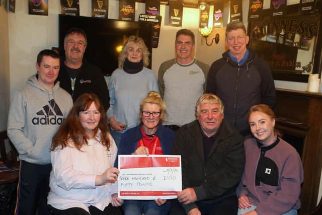 Members of Ballycastle & District Horse Ploughing Society presenting a donation to Air Ambulance Northern Ireland on behalf of the Black family.