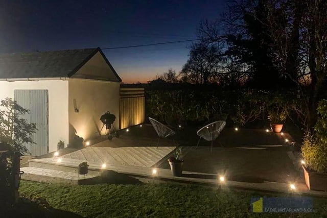 To the side and rear is a fully enclosed concrete yard and garden laid in lawn, and a recently installed decked area with LED lighting.