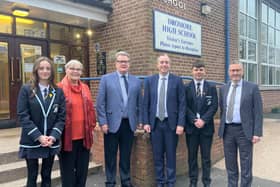 Education Minister Paul Givan with Principal Ian McConaghy (far right), members of the Board of Governors, Head Girl and Head Boy, during a visit to Dromore High School.