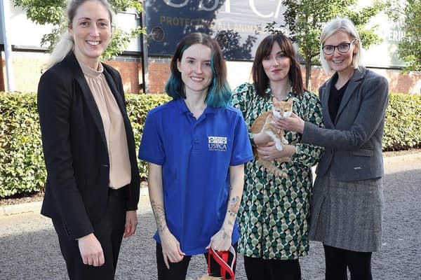 Pictured (l-r) are Gemma Daly, Deputy Chief Veterinary Officer, DAERA, Darragh McShane with her adopted dog Fergus, Leanne Williams with her adopted cat Charlie and Nora Smith, CEO of the USPCA. Pic: Peter O'Hara Photography