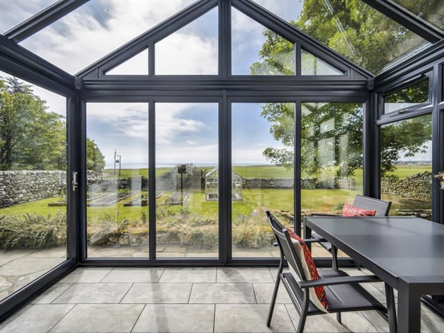 Clynemilton Farmhouse has a bright and airy feel, with large windows flooding the interior with natural light.