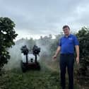 Kieran Lavelle, CAFRE Senior Adviser, observing a water dispersion from the remote-controlled ground sprayer at the recent orchard demonstration.