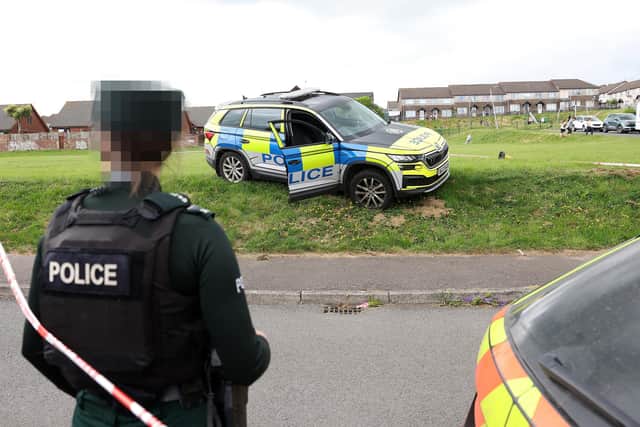Man charged after officer hit by stolen police car