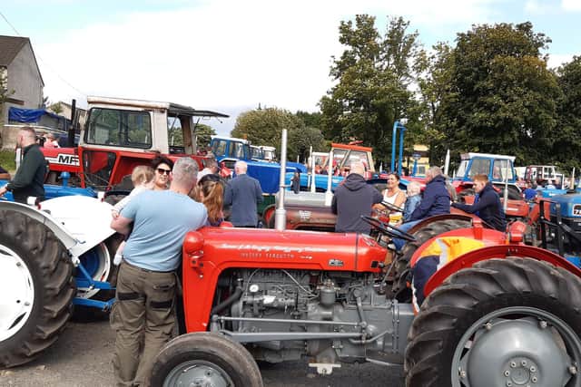 Some of the big crowd that turned up to look at the tractors parked up at Draperstown Livestock Market during the Bradley's Corner vintage tractor run. Picture: Darryl Armitage