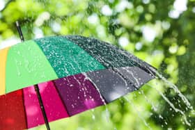 Colorful umbrella outdoors on rainy day