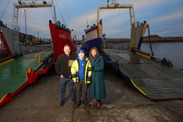 Pictured with Séan are his partentsl John and Elaine in Burtonport after the 16-year-old helped on the Arranmore Ferry. (Photo Brian Farrell)