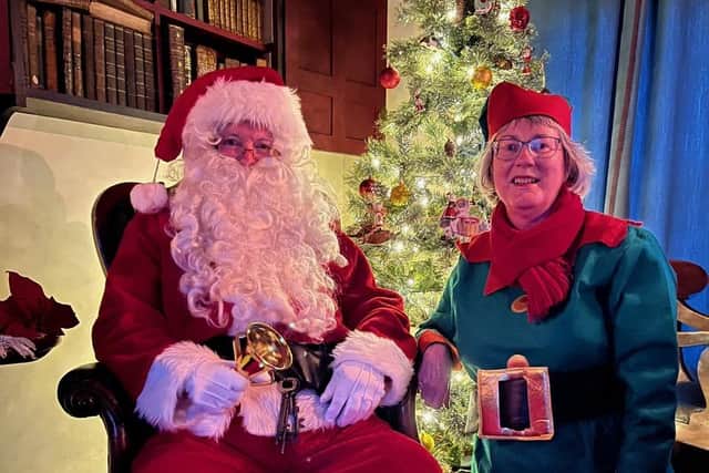 Santa and Elf helper await your visit.