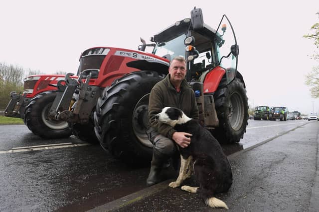 Ballygowan farmer Sam Hanna, with his dog Roy, on Sydenham by-pass in Belfast, as the National Fuel Protest against rising fuel prices continues. Picture date: Tuesday April 14, 2026. PA Photo. Photo credit should read: Liam McBurney/PA Wire